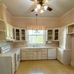 Beautiful 100-year-old historic home in Opelika, AL, featuring original hardwood floors, vintage cabinetry, and charming architectural details.