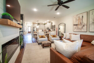 Luxury townhouse living room with a cozy fireplace, plush seating, and warm natural light, perfect for relaxing or entertaining.
