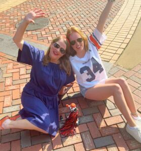 Laura and Ashley by engraved brick at Auburn Tiger Walk