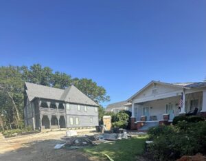Old Auburn home next to new construction building on East Thach Avenue
