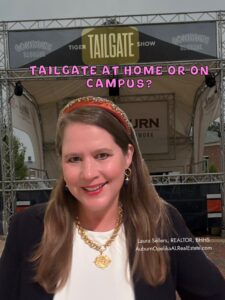 Auburn fans tailgating with tents and grills near Jordan-Hare Stadium