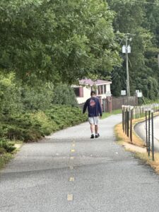 Retiree walking along peaceful trail in Auburn, Alabama