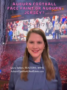 Auburn fans with face paint and jerseys on game day