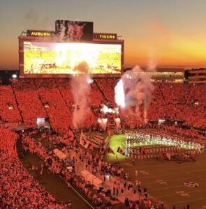 Auburn vs Georgia Game Night at Jordan-Hare | REALTOR® Laura Sellers, Auburn, AL Auburn vs Georgia game night fire bursts and band at Jordan-Hare Stadium