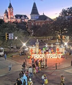 Families celebrating the final downtown Auburn Halloween Trick-or-Treat