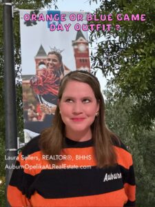 Auburn fans wearing orange and blue outfits on game day near Jordan-Hare Stadium.