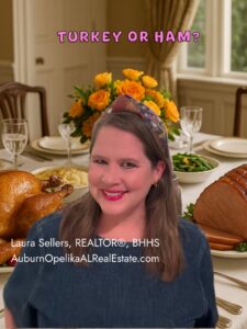 Thanksgiving dinner table in Auburn, Alabama with turkey, ham, and fall décor.