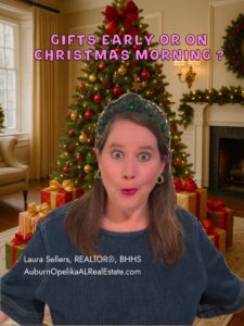 Auburn family opening Christmas gifts in a festive holiday living room