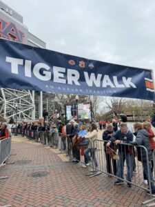 Auburn fans at Toomer’s Corner, Downtown Auburn, Jordan-Hare Stadium, and Thach Concourse on game day.