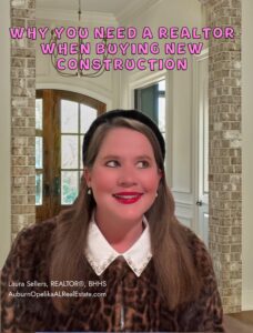 REALTOR helping clients review new construction plans in Auburn Alabama
