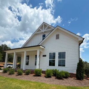 Dickson Place neighborhood entrance and community site plan in Opelika, Alabama featuring new construction homes, townhomes, resort-style amenities, and modern living near Auburn.