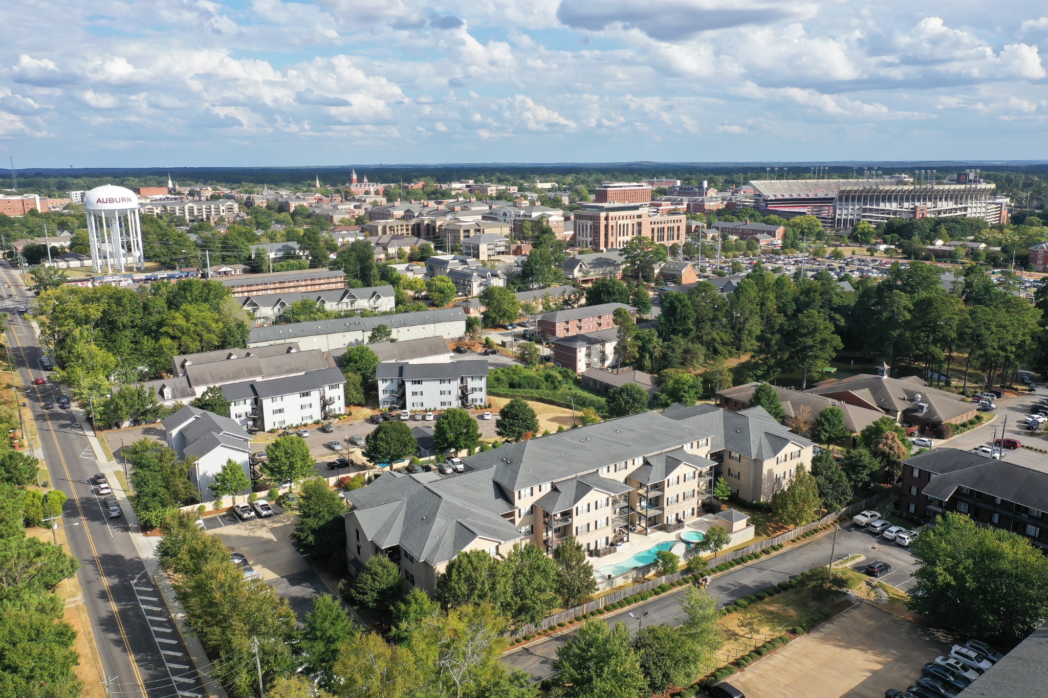 Aerial view of Auburn condominium buildings with Auburn University in the background